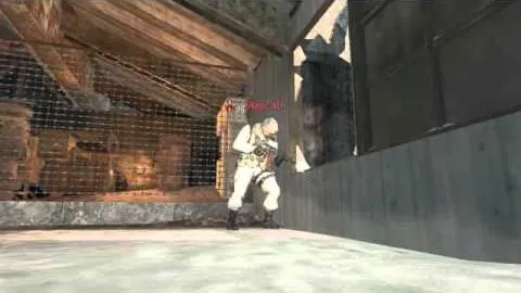 A soldier braced against a corrugated wall inside a warehouse, an enemy nameplate flashing red beside him.